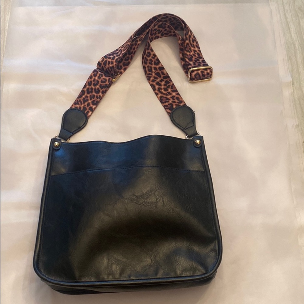 Brand New black crossbody bag with leopard strap